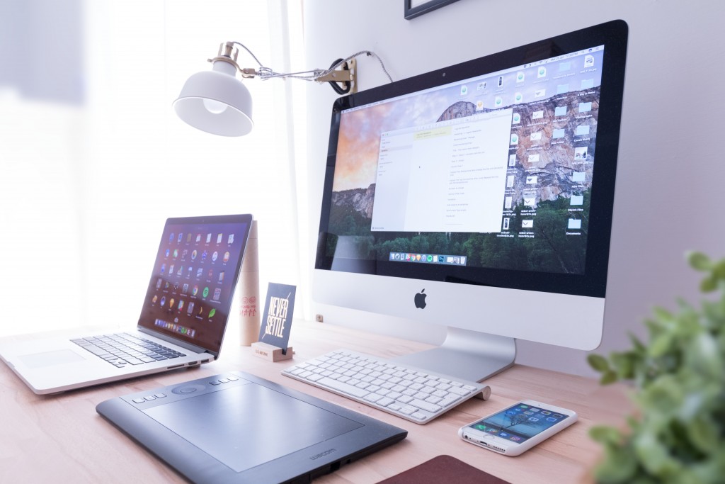 mac set up showing a digital community on screen