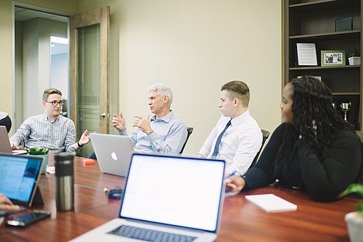 discussing things at a corporate alumni meeting