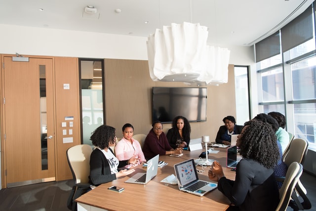 group of people discussing an online mentorship program